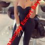Promotional mirror selfie of a woman in a strapless black jumpsuit at a salon, with a red diagonal escort banner across the image. Promotional mirror selfie of a woman in a strapless black jumpsuit at a salon, with a red diagonal escort banner across the image.