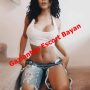 Woman in a white crop top and ripped denim shorts posing on stairs, with a red diagonal watermark reading 'Gaziantep Escort Bayan'.